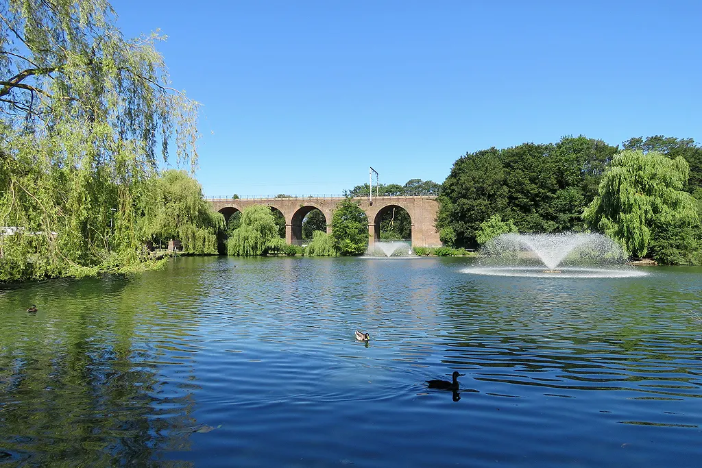 The lake, fountain and railway viaduct in Central Park, Chelmsford